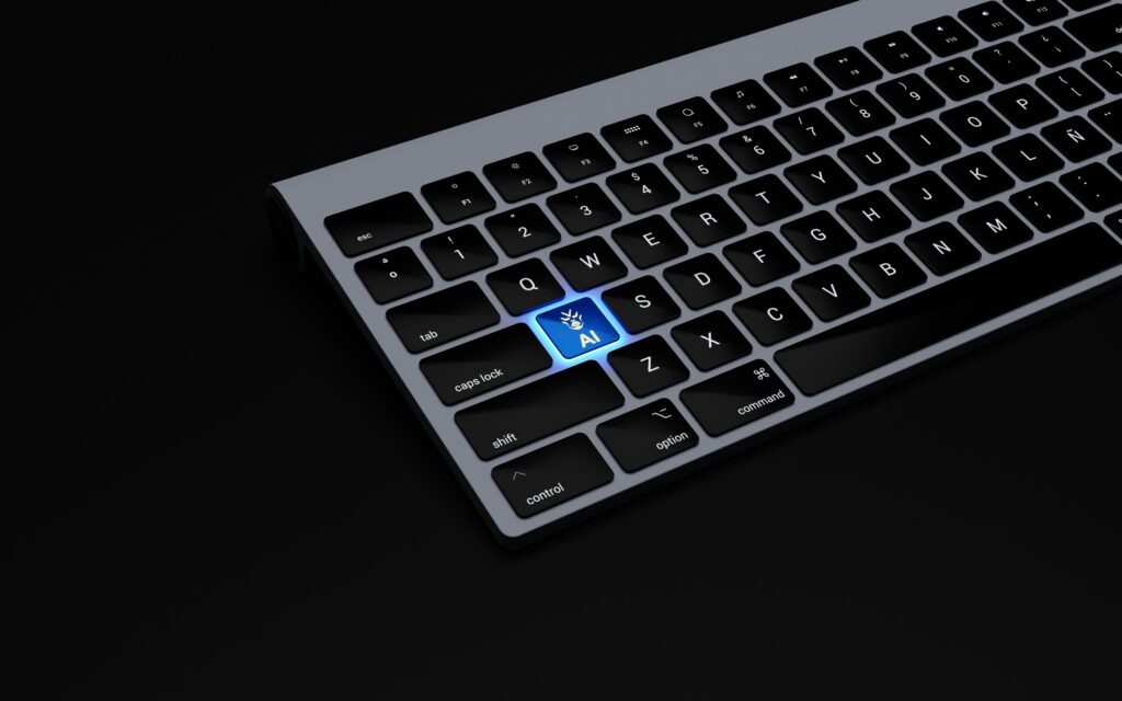 Close-up of a computer keyboard with a glowing blue "AI" key, symbolizing artificial intelligence integration in technology and automation.